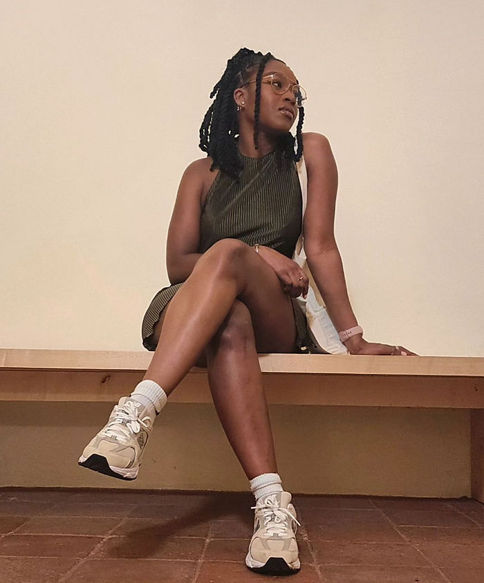 Jonette sitting on a bench 
